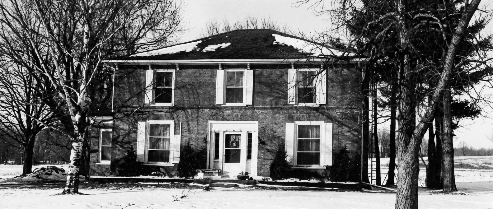 Archival photograph of the farmhouse, circa 1980