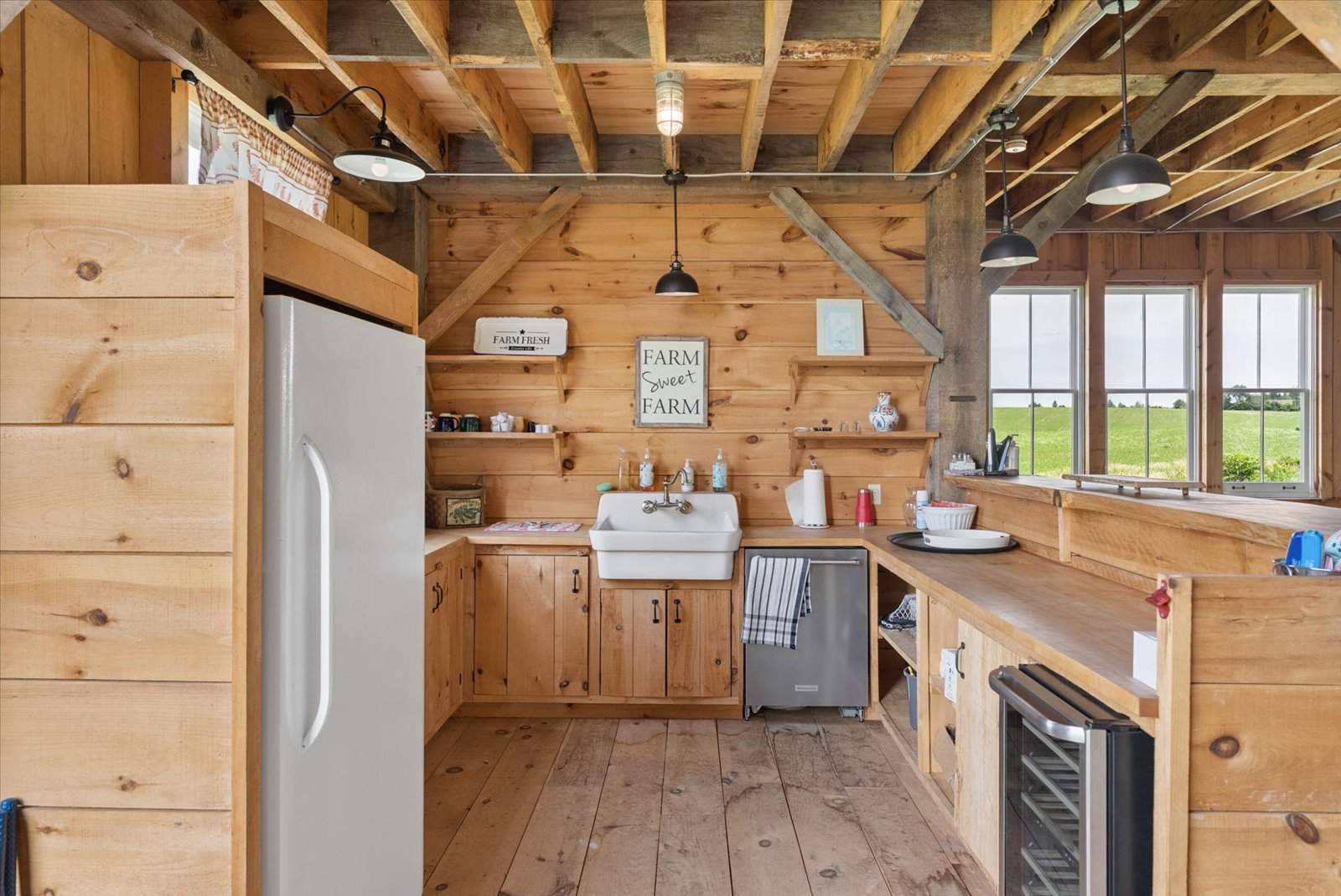 Barn kitchen with farmhouse sink and window over the fields